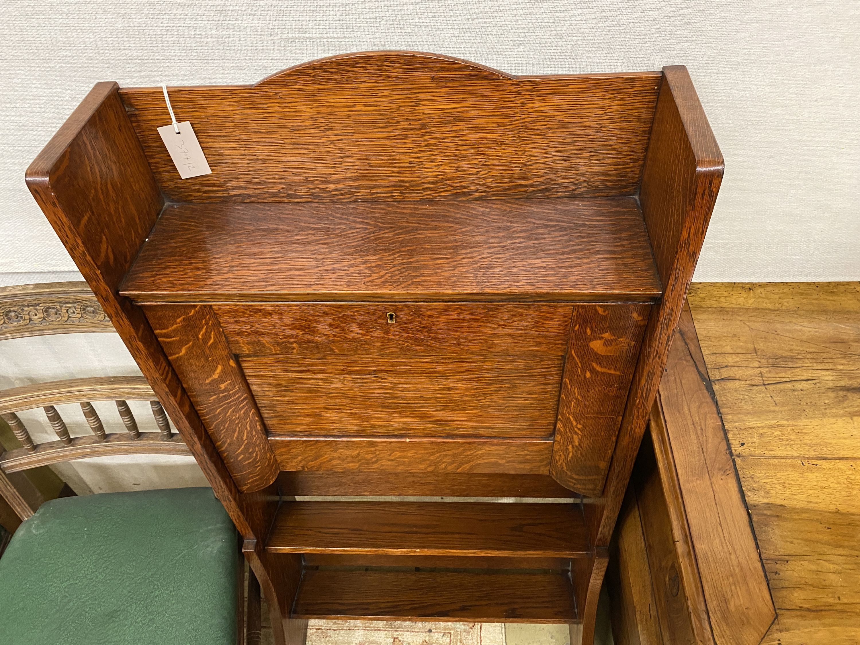 An early 20th century oak bureau, width 61cm, depth 17cm, height 122cm